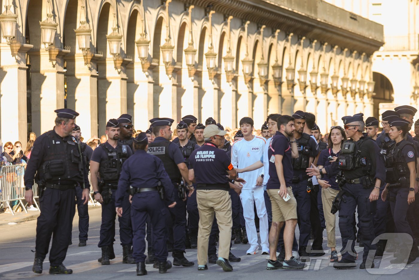 Jin of BTS Was Escorted by Around 30 French National Police Officers as He Carried the Torch for The 2024 Summer Olympics in Paris